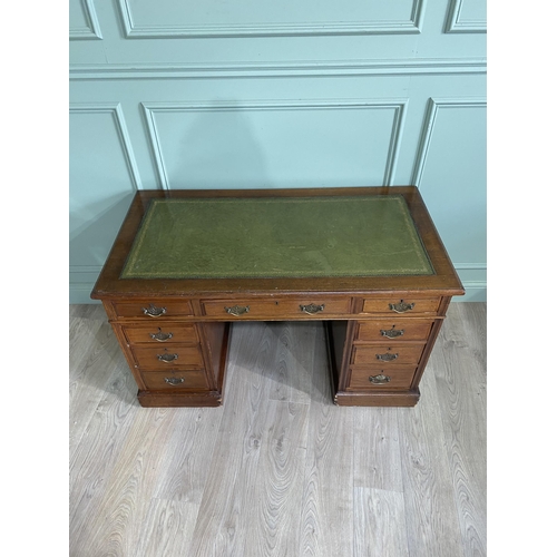 1217 - Edwardian oak pedestal desk with inset leather top {72 cm H x 123 cm W x 66 cm D}.