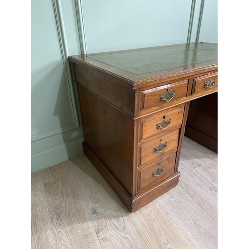 1217 - Edwardian oak pedestal desk with inset leather top {72 cm H x 123 cm W x 66 cm D}.