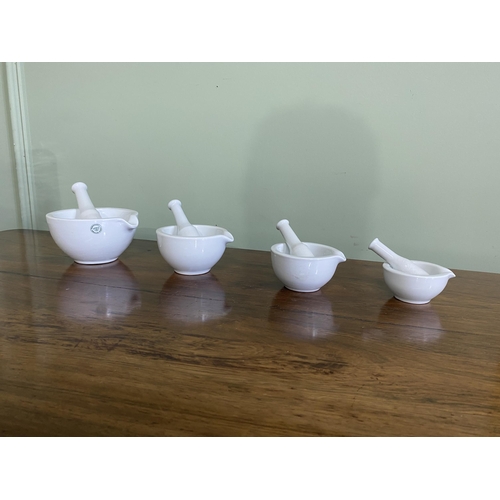 1224 - Set of four early 20th C. French ceramic graduated pestle and mortars {Largest 7 cm H x 14 cm W x 13... 