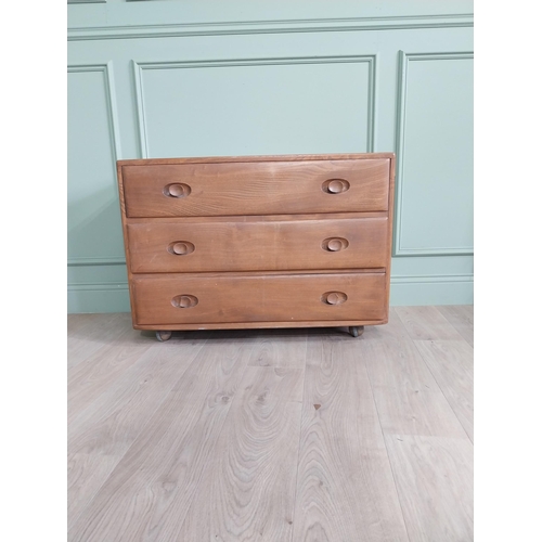 1226 - Oak Ercol chest of drawers with three drawers {66 x 92 x 44 cm D}.