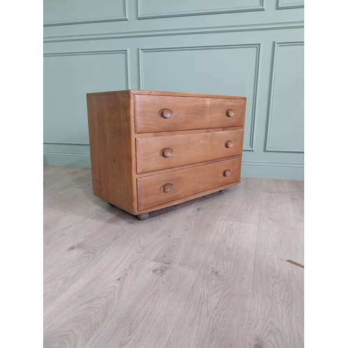 1226 - Oak Ercol chest of drawers with three drawers {66 x 92 x 44 cm D}.