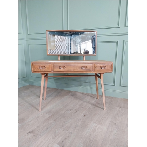 1227 - Oak Ercol dressing table with three drawers in the frieze raised on square tapered legs {124 x 115 x... 