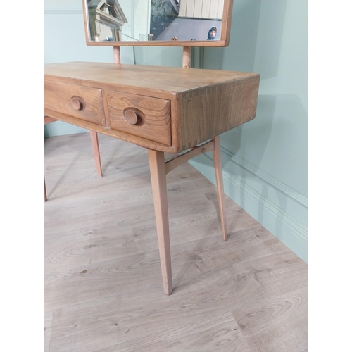 1227 - Oak Ercol dressing table with three drawers in the frieze raised on square tapered legs {124 x 115 x... 