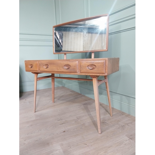 1227 - Oak Ercol dressing table with three drawers in the frieze raised on square tapered legs {124 x 115 x... 