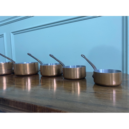 1237 - Set of five good quality copper saucepans with wrought iron handles {Largest 18 cm H x 37 cm W x 18 ... 