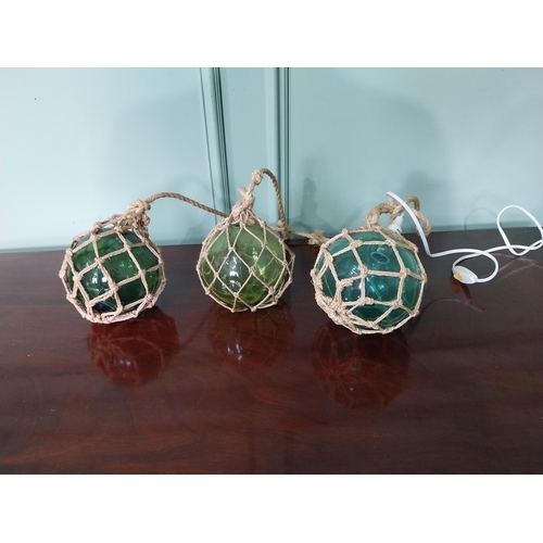 1248 - Three vintage glass buoys one electrified {16 cm Dia.}.