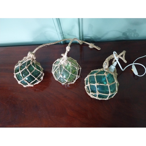 1248 - Three vintage glass buoys one electrified {16 cm Dia.}.