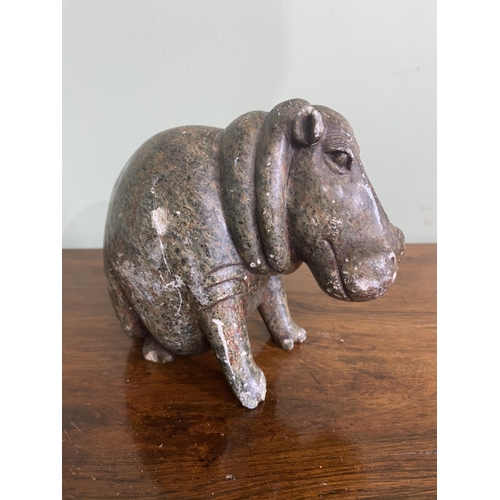 1254 - Carved soap stone statuette of a seated Hippopotamus {13 cm H x 8 cm W x 14 cm D}.