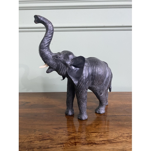 1264 - Early 20th C. French leather statuette of an Elephant {36 cm H x 32 cm W x 12 cm D}.