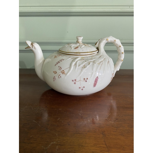 1268 - Belleek plate and teapot {3 cm H x 29 cm W x 25 cm D and 13 cm H x 23 cm W x 18 cm D}.