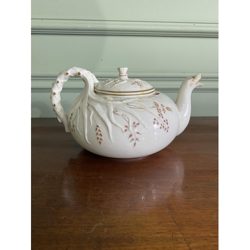 1268 - Belleek plate and teapot {3 cm H x 29 cm W x 25 cm D and 13 cm H x 23 cm W x 18 cm D}.