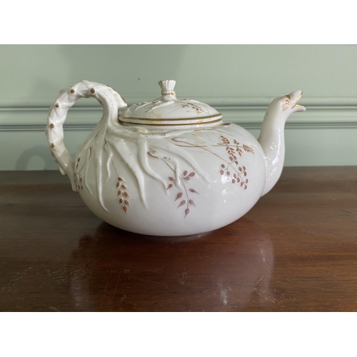 1268 - Belleek plate and teapot {3 cm H x 29 cm W x 25 cm D and 13 cm H x 23 cm W x 18 cm D}.