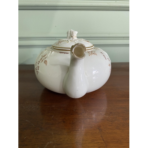 1268 - Belleek plate and teapot {3 cm H x 29 cm W x 25 cm D and 13 cm H x 23 cm W x 18 cm D}.