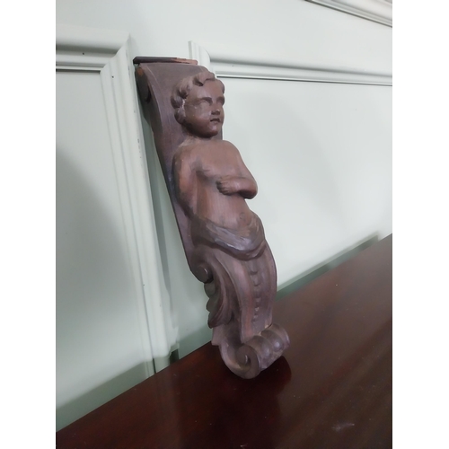 1269 - 18th C. carved oak corbel depicting Boy {37 cm H x 9 cm W x 7 cm D}.