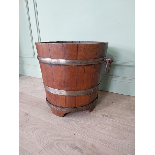 127 - Good quality Edwardian metal bound oak log bucket with wrought iron handles {43 cm H x 54 cm Dia.}.