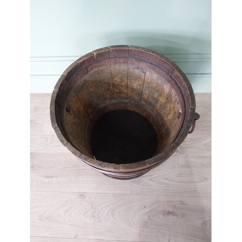 127 - Good quality Edwardian metal bound oak log bucket with wrought iron handles {43 cm H x 54 cm Dia.}.