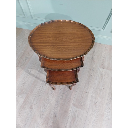 128 - Nest of three walnut tables raised on cabriole legs {55 cm H x 60 cm W x 44 cm D}.