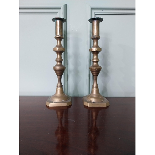 1282 - Pair of brass candlesticks {13 cm H x 9 cm Dia.}.