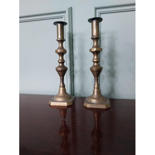 1282 - Pair of brass candlesticks {13 cm H x 9 cm Dia.}.