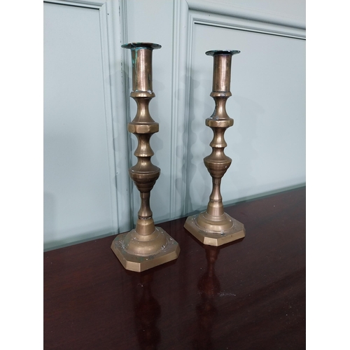 1282 - Pair of brass candlesticks {13 cm H x 9 cm Dia.}.