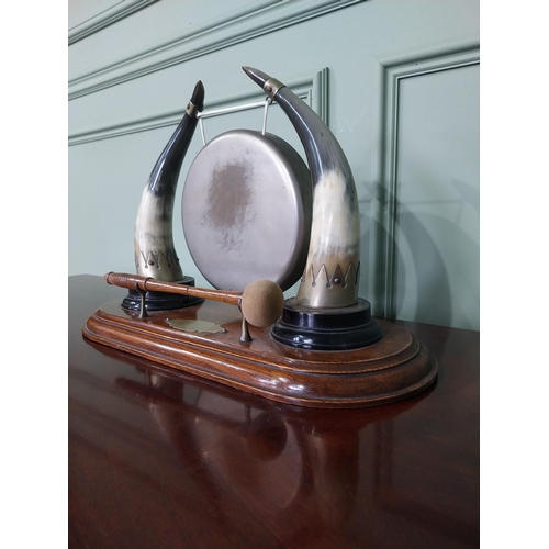 129 - Early 20th C. dinner gong made from cow horns and silver plate mounts mounted on oak plinth {33 cm H... 