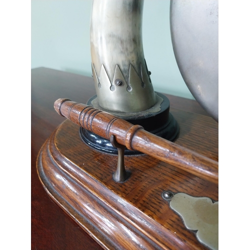 129 - Early 20th C. dinner gong made from cow horns and silver plate mounts mounted on oak plinth {33 cm H... 