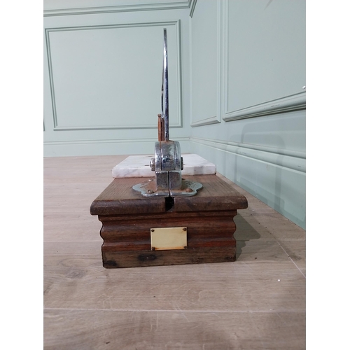 13 - Chrome and marble cheese cutter mounted on mahogany base {77 cm H x 60 cm W x 22 cm D}.