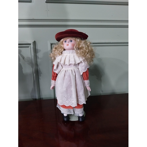 1301 - Two vintage porcelain children's dolls in the early 20th C. clothing {Approx. 45 cm H x 23 cm Dia.}.