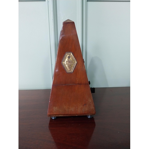 1302 - Good quality French mahogany metronome {23 cm H x 12 cm W x 11 cm D}.