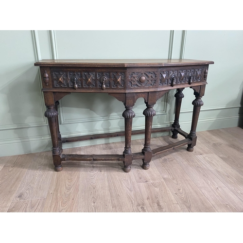 1314 - Carved oak side table with two drawers in the frieze raised on turned legs{77 cm H x 122 cm W x 52 c... 