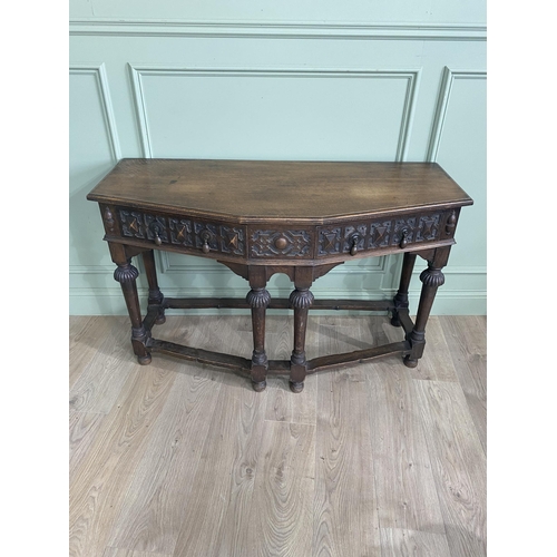 1314 - Carved oak side table with two drawers in the frieze raised on turned legs{77 cm H x 122 cm W x 52 c... 