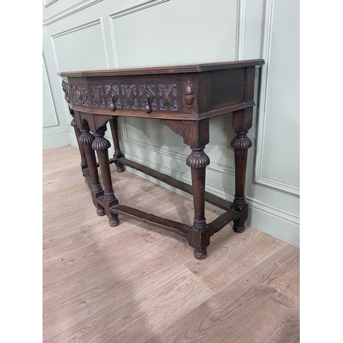 1314 - Carved oak side table with two drawers in the frieze raised on turned legs{77 cm H x 122 cm W x 52 c... 