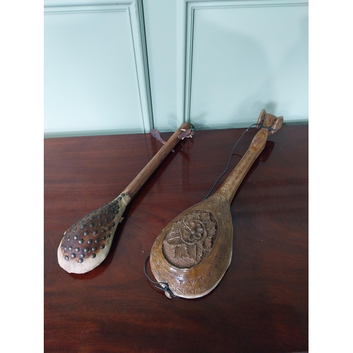 1321 - Two Primitive Middle Eastern musical instruments {59 cm H AND 55 cm H}.