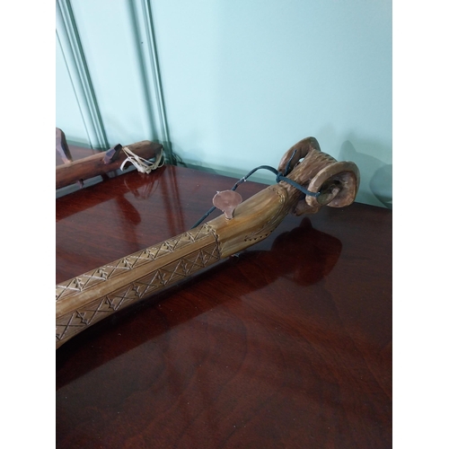 1321 - Two Primitive Middle Eastern musical instruments {59 cm H AND 55 cm H}.