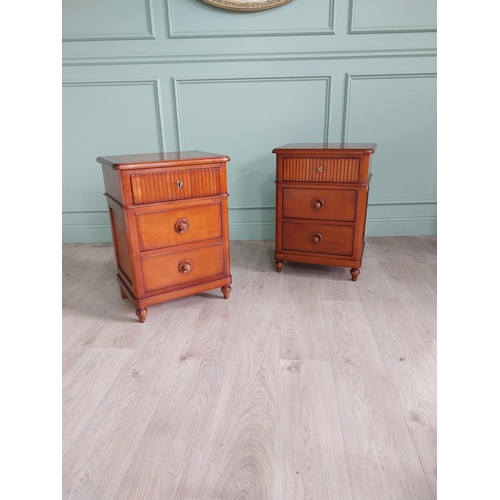 1323 - Pair of cherry wood bedside cabinets with three drawers raised on turned legs {69 cm H x 50 cm W x 3... 