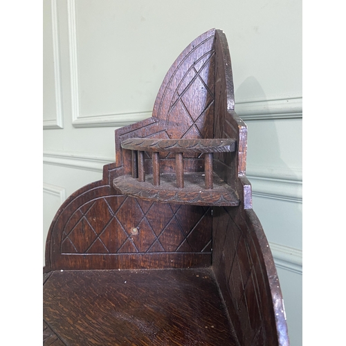 1332 - Edwardian carved oak wall hanging corner cupboard {73 cm H x 40 cm W x 30 cm D}.