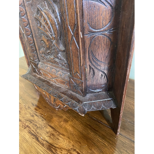 1332 - Edwardian carved oak wall hanging corner cupboard {73 cm H x 40 cm W x 30 cm D}.