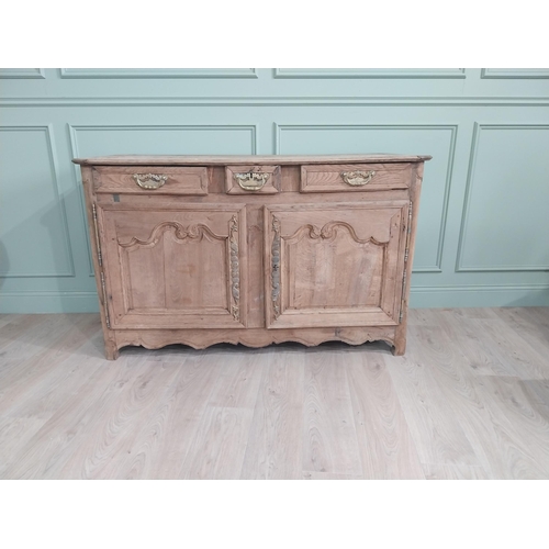 134 - 19th C. bleached oak side cabinet with three drawers in frieze above two blind doors {91 cm H x 153 ... 