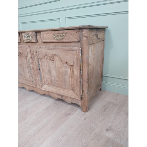 134 - 19th C. bleached oak side cabinet with three drawers in frieze above two blind doors {91 cm H x 153 ... 