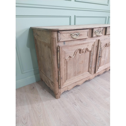 134 - 19th C. bleached oak side cabinet with three drawers in frieze above two blind doors {91 cm H x 153 ... 