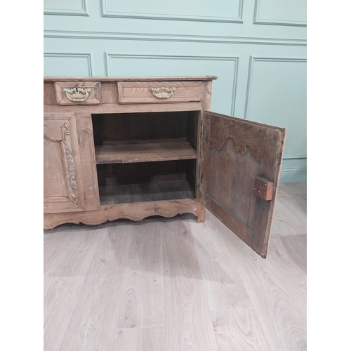 134 - 19th C. bleached oak side cabinet with three drawers in frieze above two blind doors {91 cm H x 153 ... 