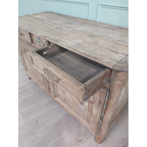 134 - 19th C. bleached oak side cabinet with three drawers in frieze above two blind doors {91 cm H x 153 ... 