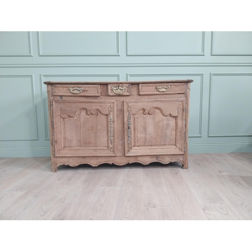 134 - 19th C. bleached oak side cabinet with three drawers in frieze above two blind doors {91 cm H x 153 ... 