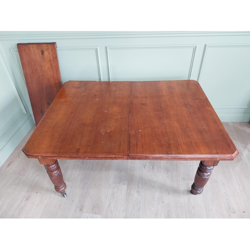 1340 - Edwardian mahogany cut corner dining table raised on reeded legs with one extra leaf {76 cm H x 155 ... 