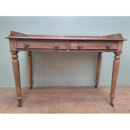 1347 - Pine side table with two drawers in the frieze raised on turned legs and castors  {H 80cm x W 115cm ... 