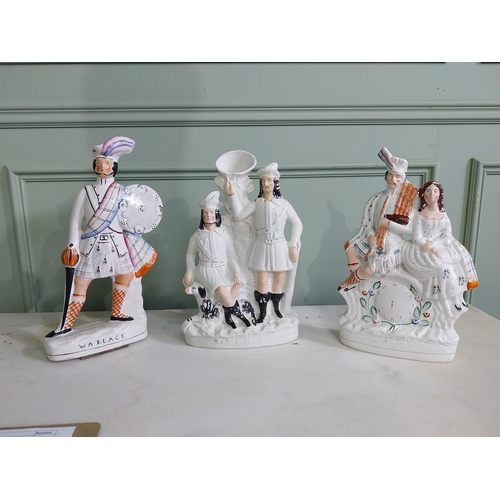 135 - Three Staffordshire ceramic figures {40 cm H, 37 cm H and 36 cm H}.