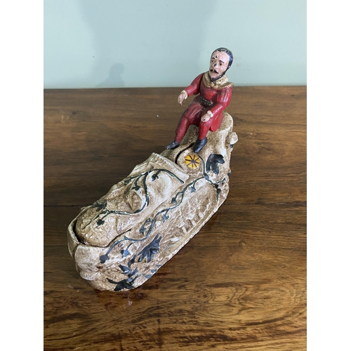 1381 - Decorative cast iron novelty money box {16 cm H x 21 cm W x 7 cm D}.