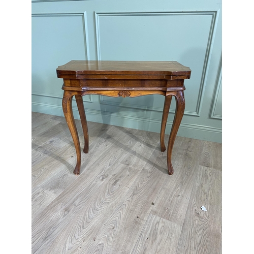 1396 - French walnut and satinwood inlaid turn over leaf card table raised on cabriole legs in the Victoria... 