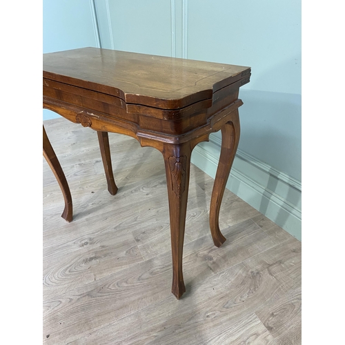 1396 - French walnut and satinwood inlaid turn over leaf card table raised on cabriole legs in the Victoria... 