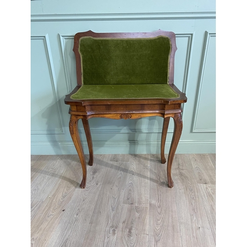 1396 - French walnut and satinwood inlaid turn over leaf card table raised on cabriole legs in the Victoria... 